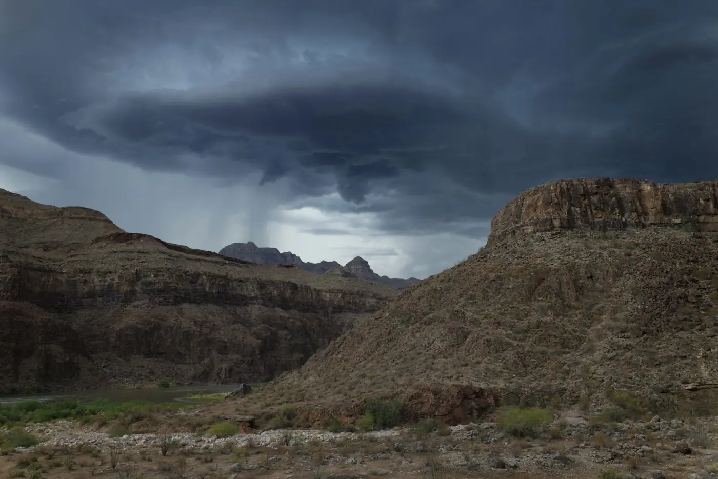 Monsoon storm clouds over desert mountains