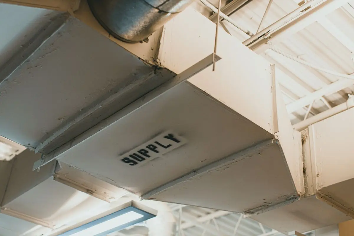 Metal supply air duct running along a ceiling