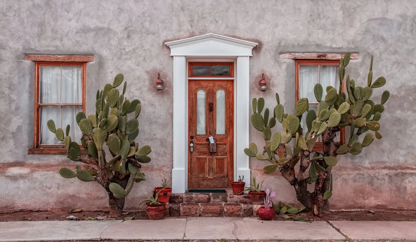 Adobe house with prickly pear cactus by the front door in Tucson